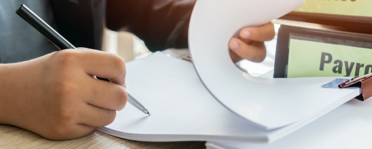 Person making manual calculations.