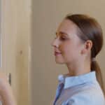 woman using fingerprint scan for access