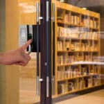 person scanning finger to get library entry